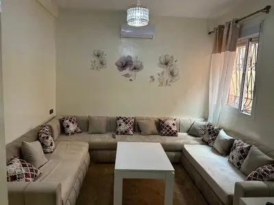 a living room with a couch and a table at Le nid zen in Marrakech