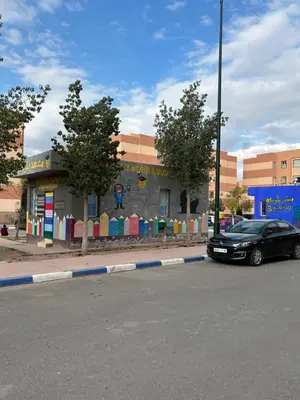 a black car parked in front of a building at Le nid zen in Marrakech