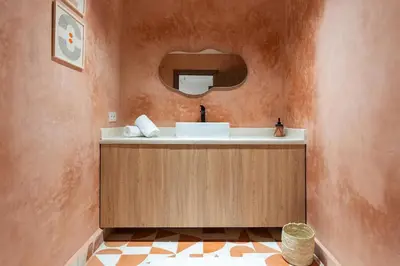 a bathroom with a sink and a mirror at Cozy suite Comfort et elegance in Marrakech