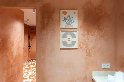a bathroom with a sink and two pictures on the wall at Cozy suite Comfort et elegance in Marrakech