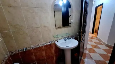 a bathroom with a sink and a mirror at Appartement Studio Sejourkech, Gueliz Plaza in Marrakech