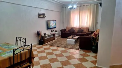 a living room with a couch and a table at Appartement Studio Sejourkech, Gueliz Plaza in Marrakech