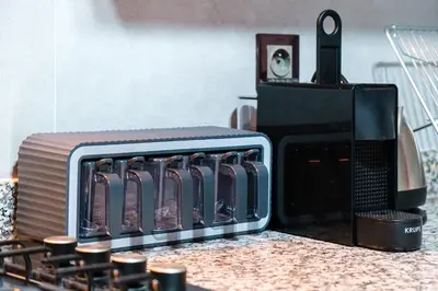a toaster oven sitting on top of a counter at Modern Appart , Parking , Pool & Fiber wifi , Hivernage City Centre in Marrakech