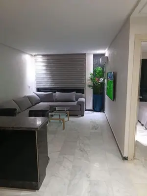 a living room with a couch and a table at Modern apartment in the Heart of the City in Marrakech