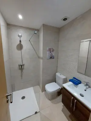 a bathroom with a toilet and a sink and a shower at Appartement centre ville marrakech in Marrakech