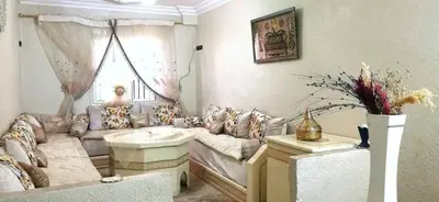 a living room with a couch and a table at Do7a Marrakech in Marrakech