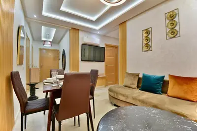 a living room with a couch and a table at Central and Cozy Gem Balcony in Marrakech