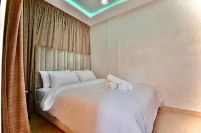 a baby doll sitting on a bed in a bedroom at Central and Cozy Gem Balcony in Marrakech
