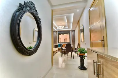 a hallway with a mirror and a dining room at Central and Cozy Gem Balcony in Marrakech
