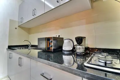 a kitchen with a counter top with a coffee maker at Central and Cozy Gem Balcony in Marrakech