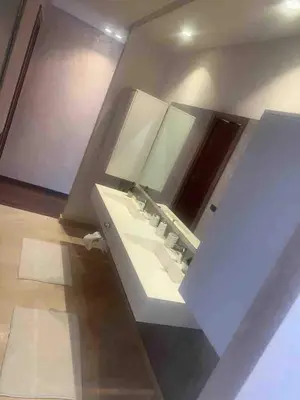 a bathroom with a sink and a mirror at Villa in Urban Morocco, Marrakech in Marrakech