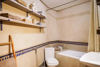 a bathroom with a toilet and a sink and a tub at Charm & Comfort in Majorelle, Close to YSL Museum in Marrakech