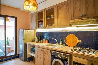 a kitchen with a sink and a stove and a dishwasher at Charm & Comfort in Majorelle, Close to YSL Museum in Marrakech