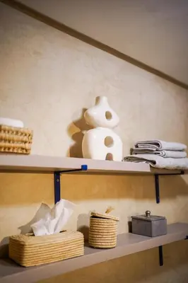 a shelf with a vase and baskets on it at Charm & Comfort in Majorelle, Close to YSL Museum in Marrakech