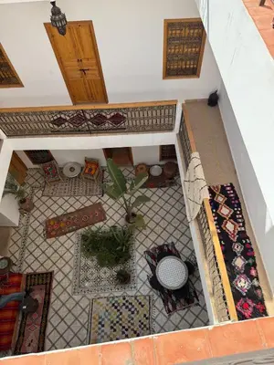 an overhead view of a living room with a tile floor at Quite riad in Marrakech