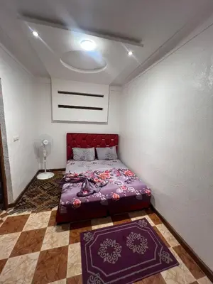 a bedroom with a purple bed in a room at Suite 1 in Marrakech