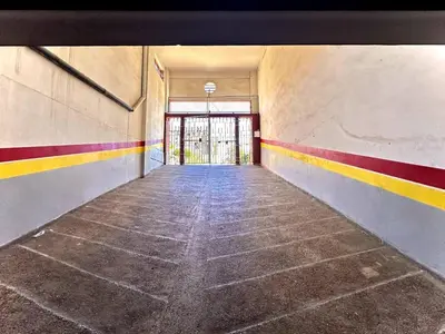 an empty hallway with colorful stripes on the walls at Marrakech in Marrakech