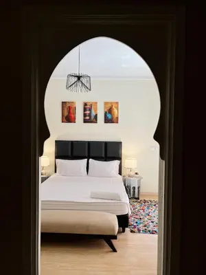 a bedroom with a bed in an arch way at Modern Studio with Pool in Central Gueliz in Marrakech