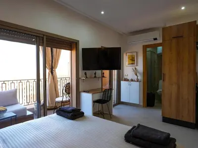 a bedroom with a bed with two pillows on it at Suite Sofia Suite avec superbe terrasse Gueliz in Marrakech