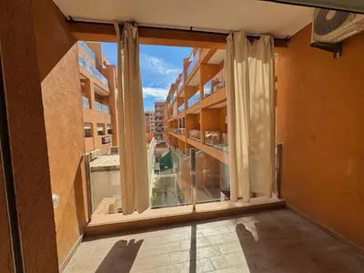 an empty balcony with a large window in a building at Atrani1 happy holiday in Marrakech