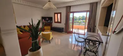 a living room with a couch and chairs and a table at La Plaza cœur de Gueliz in Marrakech