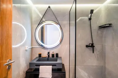 a bathroom with a sink and a mirror at Le Noria - Super logement Jardin & Piscine - Golf in Marrakech