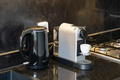 a coffee maker sitting on top of a counter at Le Noria - Super logement Jardin & Piscine - Golf in Marrakech