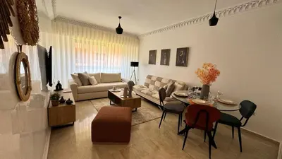a living room with a couch and a table at Mms in Marrakech