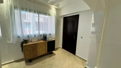 a room with a door and a window and a wooden cabinet at Mms in Marrakech