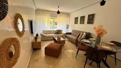 a living room with a couch and a table at Mms in Marrakech