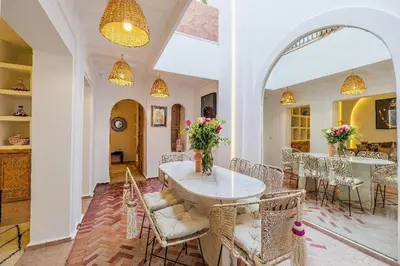 a dining room with a table and chairs at Riad Rose Exclusive New Authentic Breakfast and Pool in Marrakech