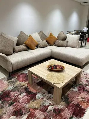 a living room with a couch and a coffee table at Appartement ZAHRA HOME in Marrakech