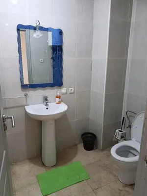 a bathroom with a sink and a toilet at family apartment 8 in Marrakech