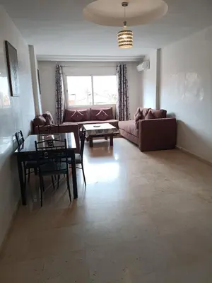 a living room with a couch and a table at family apartment 8 in Marrakech