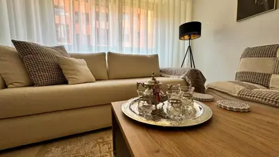 a living room with a couch and a coffee table at Modern apartment in City center in Marrakech