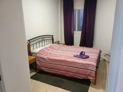 a bedroom with a bed with a teddy bear on it at 30 family apartment in Marrakech