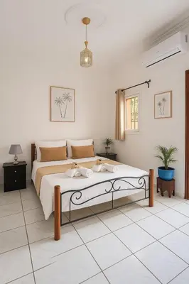 a bedroom with a large bed in a room at Riad abdel in Marrakech