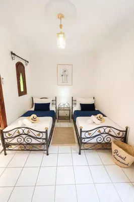 a room with two beds in a room at Riad abdel in Marrakech