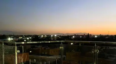 a view of a city at night with lights at Appartement 1 chambre - Superbe Terrasse & Vue Panoramique - Semlalia in Marrakech