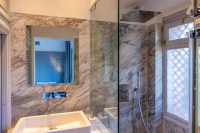 a bathroom with a sink and a shower at Luxury Oasis 2 Bedroom and Free Parking in Hivernage in Marrakech