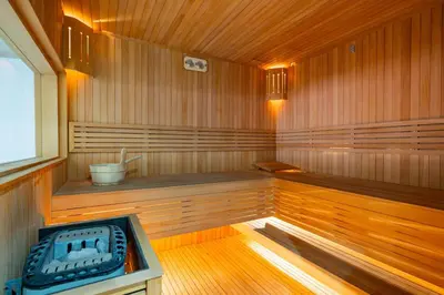 a sauna with a stove in the middle of it at Stayin 3Bedroom Duplex in Marrakech