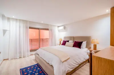 a bedroom with a large bed and a window at Stayin 3Bedroom Duplex in Marrakech