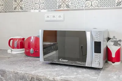 a microwave sitting on a counter in a kitchen at Spacious Family Flat in Marrakech