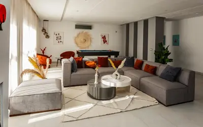 a living room with a couch and a table at Atlas Twin in Marrakech