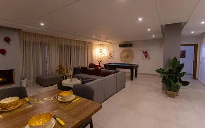 a living room with a couch and a piano at Atlas Twin in Marrakech