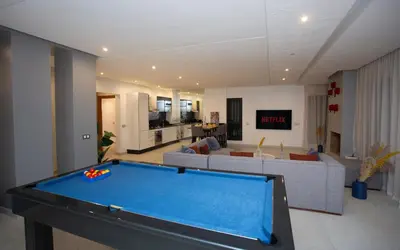 a living room with a pool table in it at Atlas Twin in Marrakech