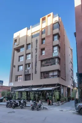 a group of motorcycles parked in front of a building at Atlas Twin in Marrakech