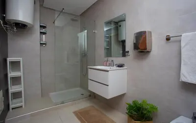 a bathroom with a shower and a toilet and a sink at Atlas Twin in Marrakech