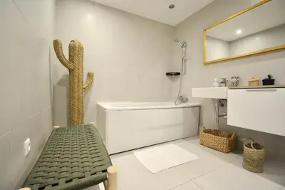 a bathroom with a cactus in the corner of the room at M17-Le Duplex-Balcon-Piscine-Majorelle in Marrakech