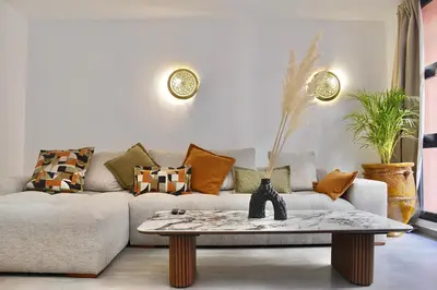 a living room with a couch and a coffee table at M17-Le Duplex-Balcon-Piscine-Majorelle in Marrakech